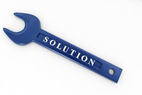 Blue wrench with word solution on white background stock photo