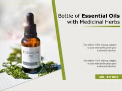 Bottle of essential oils with medicinal herbs