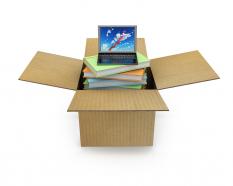 Box with laptop inside shows technology stock photo