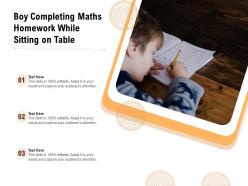 Boy Completing Maths Homework While Sitting On Table