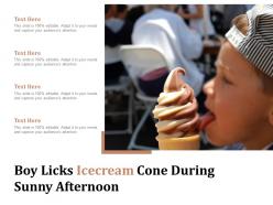 Boy licks icecream cone during sunny afternoon