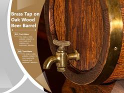 Brass tap on oak wood beer barrel