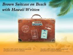 Brown suitcase on beach with hawaii written
