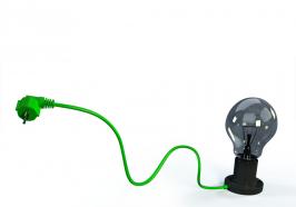 Bulb With Green Cable Of Plug Technology Stock Photo