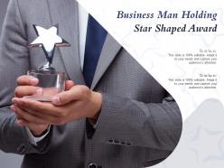 Business man holding star shaped award