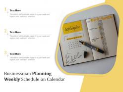 Businessman planning weekly schedule on calendar