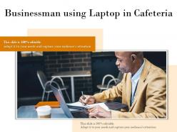 Businessman using laptop in cafeteria