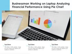 Businessman working on laptop analyzing financial performance using pie chart