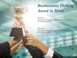 Businessmen holding award in hand