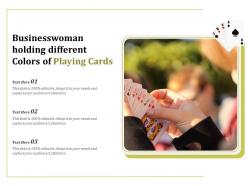 Businesswoman holding different colors of playing cards