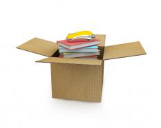 Carton with books and mouse inside education technology stock photo