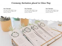 Ceremony invitation placed in glass tray