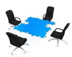 Chairs Around Puzzle Table Stock Photo
