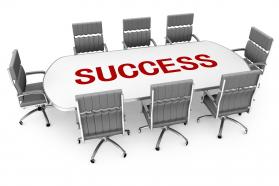 Chairs with conference table and word success stock photo