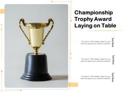 Championship trophy award laying on table