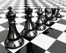 Chess pieces on chess board for team strategy stock photo