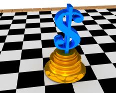 Chessboard and dollar on podium stock photo