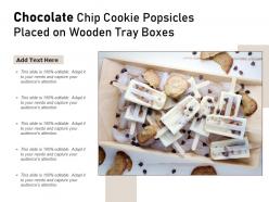 Chocolate chip cookie popsicles placed on wooden tray boxes
