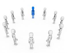 Circle of 3d men with one blue man shows leadership stock photo
