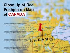 Close up of red pushpin on map of canada