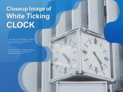 Closeup image of white ticking clock