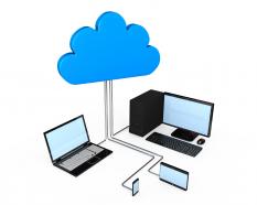 Cloud with desktop laptop displaying cloud computing stock photo