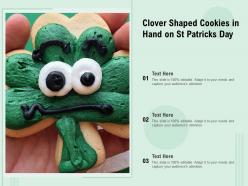 Clover shaped cookies in hand on st patricks day