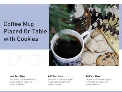Coffee mug placed on table with cookies