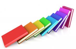 Colored books aligned like domino stock photo
