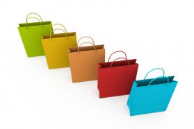 Colorful shopping bags in line stock photo