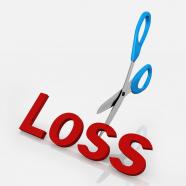 Concept of cutting loss in business stock photo