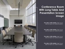 Conference room with long table and presentation screen image