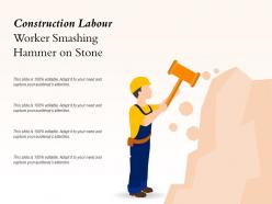 Construction labour worker smashing hammer on stone
