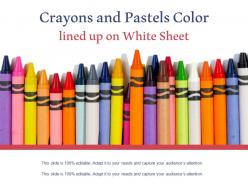 Crayons and pastels color lined up on white sheet