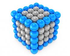 Cube made of silver and blue balls displaying team strength stock photo