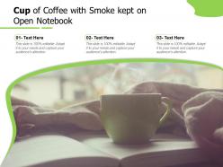 Cup of coffee with smoke kept on open notebook