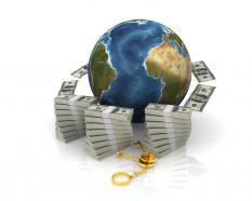 Currencies around the globe concept stock photo