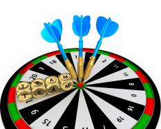 Dartboard with blue arrows and dices of team stock photo