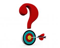Dartboard with question mark showing target of question stock photo