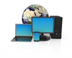 Devices with globe showing concept of global communication stock photo
