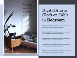 Digital alarm clock on table in bedroom