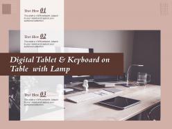 Digital tablet and keyboard on table with lamp