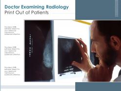 Doctor examining radiology print out of patients