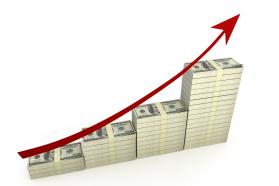 Dollar bar graph with red growth arrow stock photo