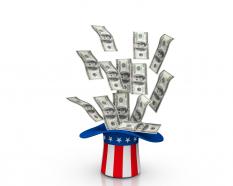 Dollars coming out from hat made by us flag stock photo