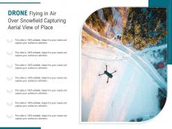 Drone flying in air over snowfield capturing aerial view of place