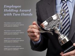 Employee holding award with two hands