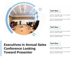 Executives in annual sales conference looking toward presenter