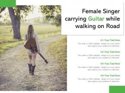 Female singer carrying guitar while walking on road
