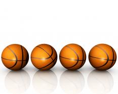 Four basketballs in linear order game theme stock photo